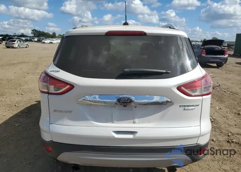 2016 Ford Escape Titanium z USA, uszkodzony, nr VIN 1FMCU9J91GUC90640